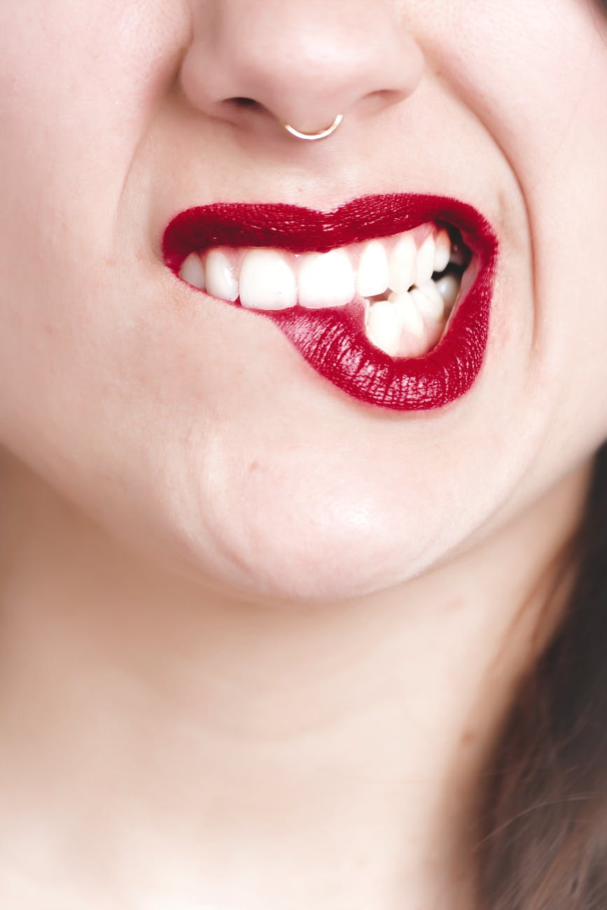 photography of woman s red lip