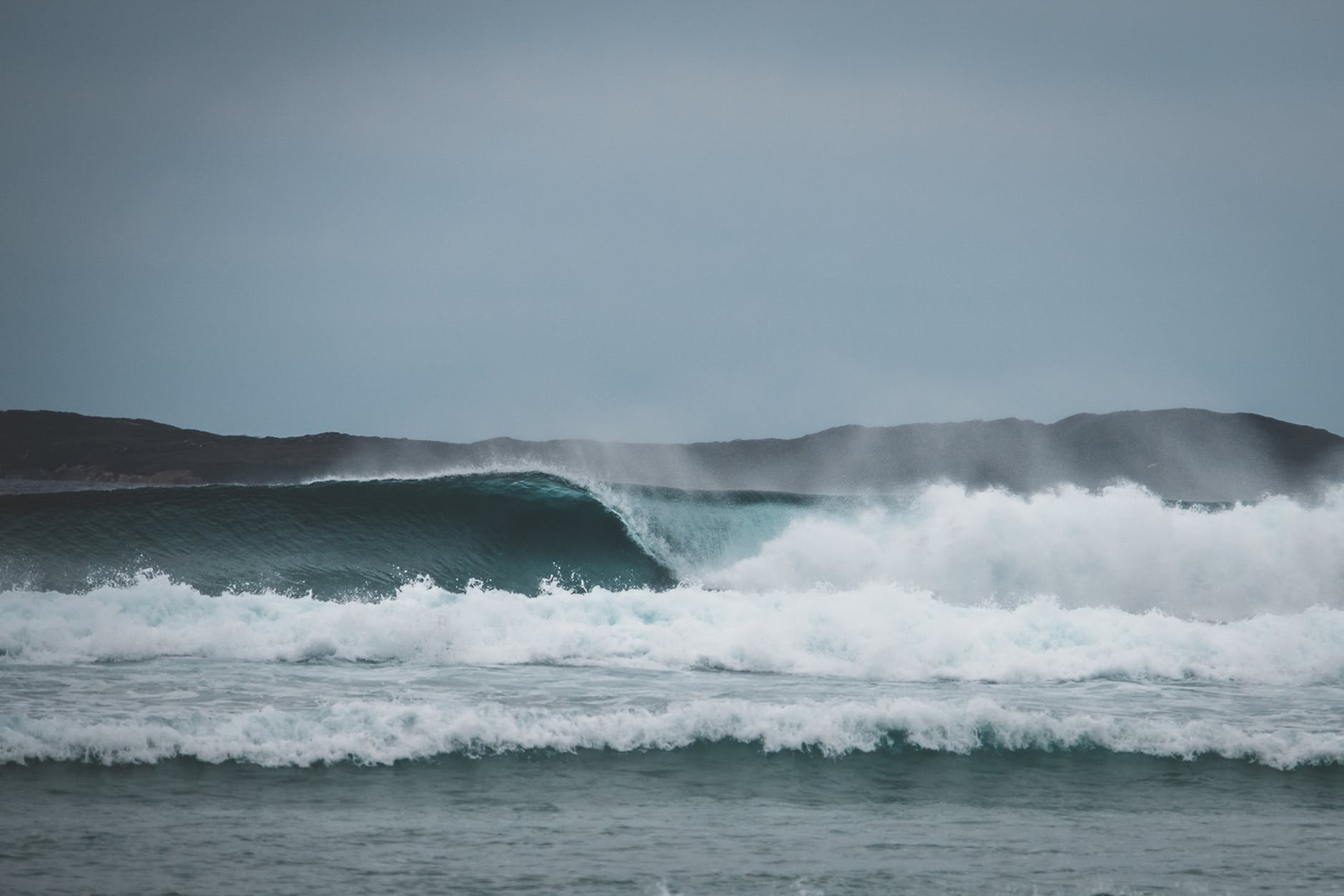 stormy sea waving against cloudless sky