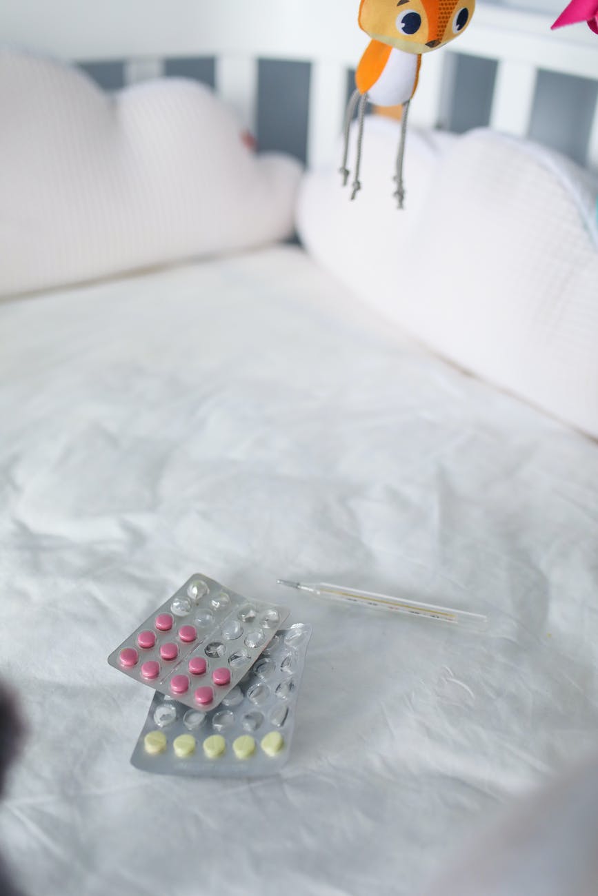 silver blister pack on bed