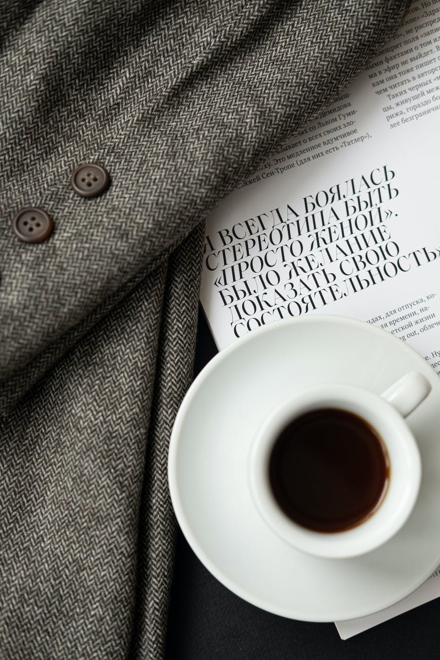 white ceramic mug on white book page
