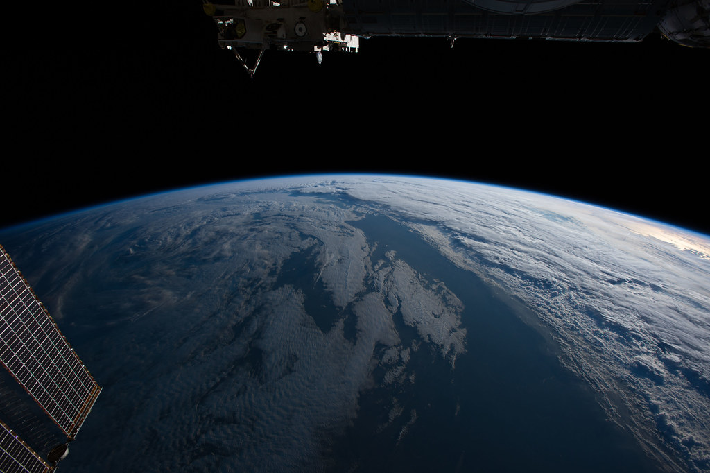 The International Space Station orbits toward another sunrise as it orbits Earth traveling more than 17,500 miles per hour.