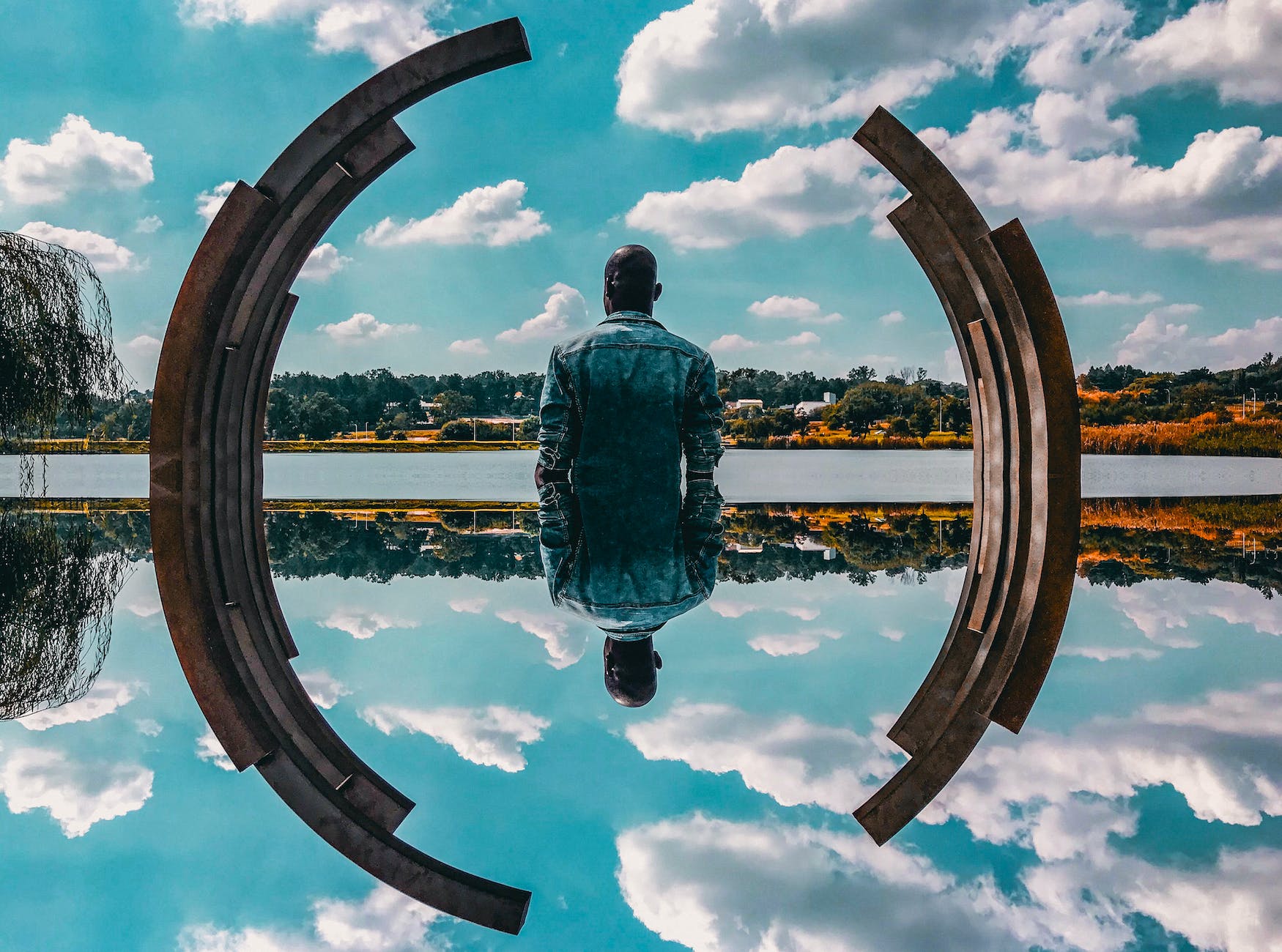 man standing near body of water