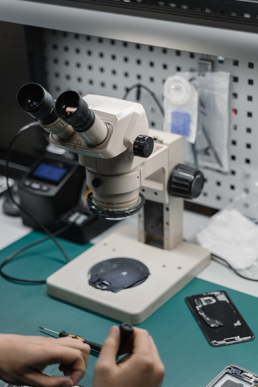 close up shot of a person repairing a device
